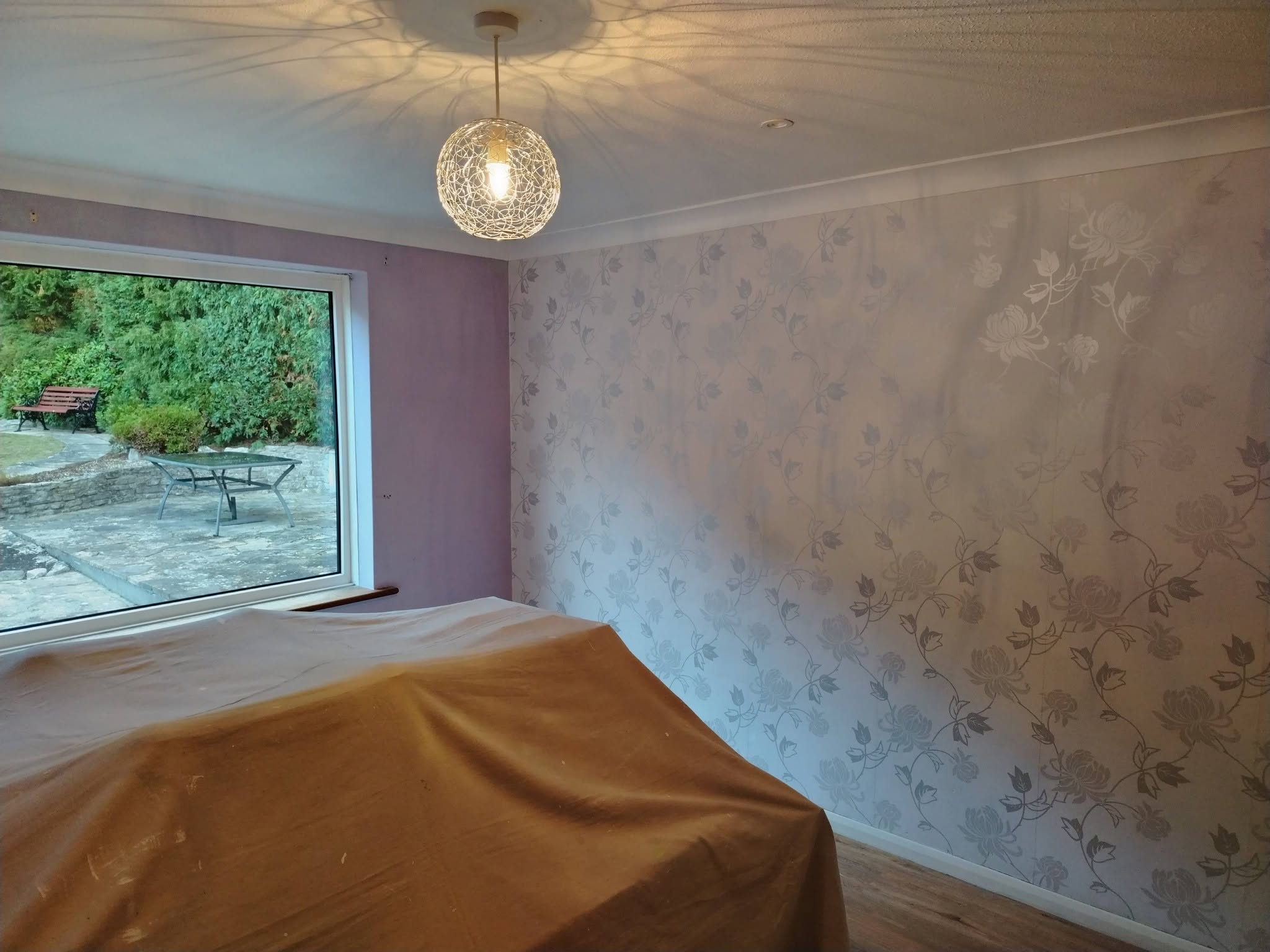 The old floral feature wallpaper before stripping